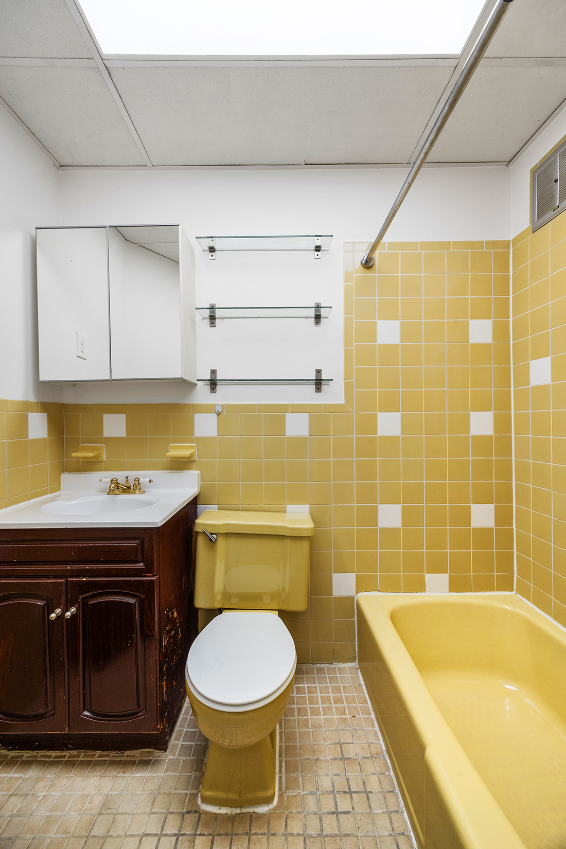 239 Withers Street Brooklyn, NY 11211 - Photo 11 of 14 a bathroom with a sink a bathtub and a toilet