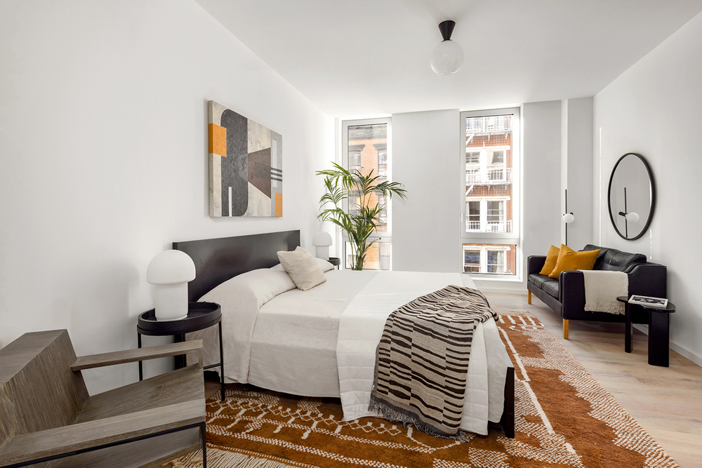 66 Clinton Street, Unit 6A Manhattan, NY 10002 - Photo 9 of 21 a bedroom with bed and a window