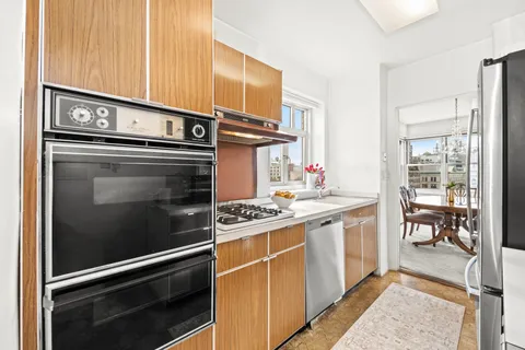 a kitchen with stainless steel appliances granite countertop a stove and a sink