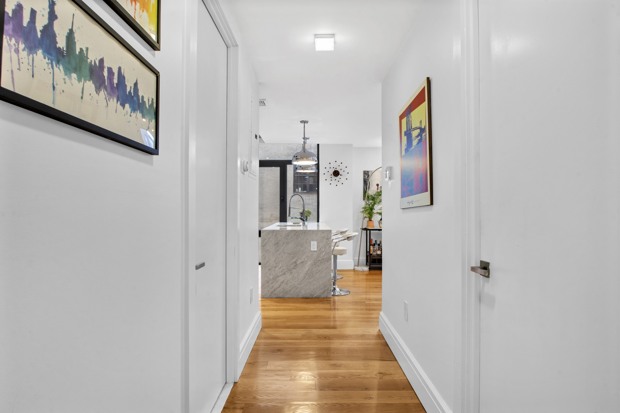 47 Bridge Street, Unit 3D Brooklyn, NY 11201 - Photo 14 of 27 a view of a hallway with wooden floor and a bathroom