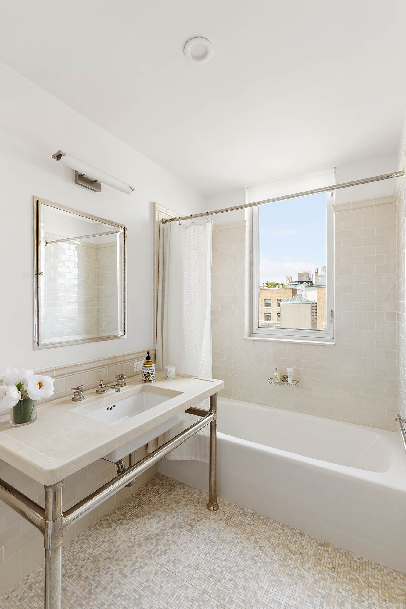 545 West 110th Street, Unit PH11A Manhattan, NY 10025 - Photo 15 of 22 a bathroom with a tub sink and mirror