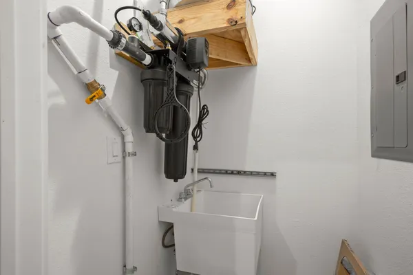a bathroom with a sink and mirror