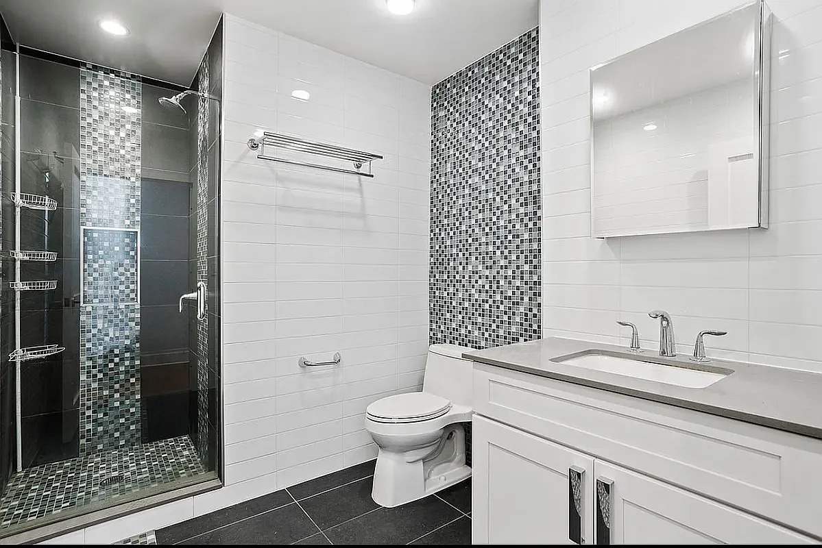 25 Lexington Avenue, Unit 202 Brooklyn, NY 11238 - Photo 6 of 7 a bathroom with a sink a toilet and shower