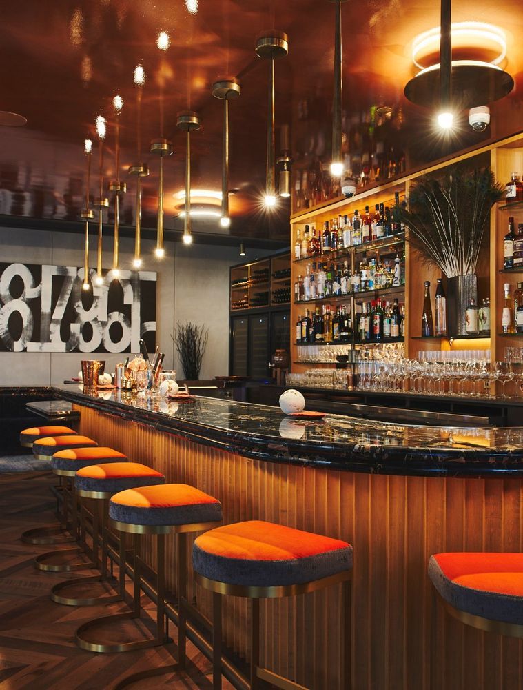 246 Spring Street, Unit 4111 Manhattan, NY 10013 - Photo 12 of 19 a kitchen with stainless steel appliances granite countertop a sink a stove and a wooden cabinets