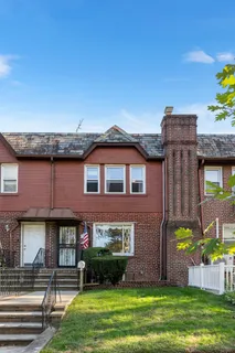 a front view of a building with garden