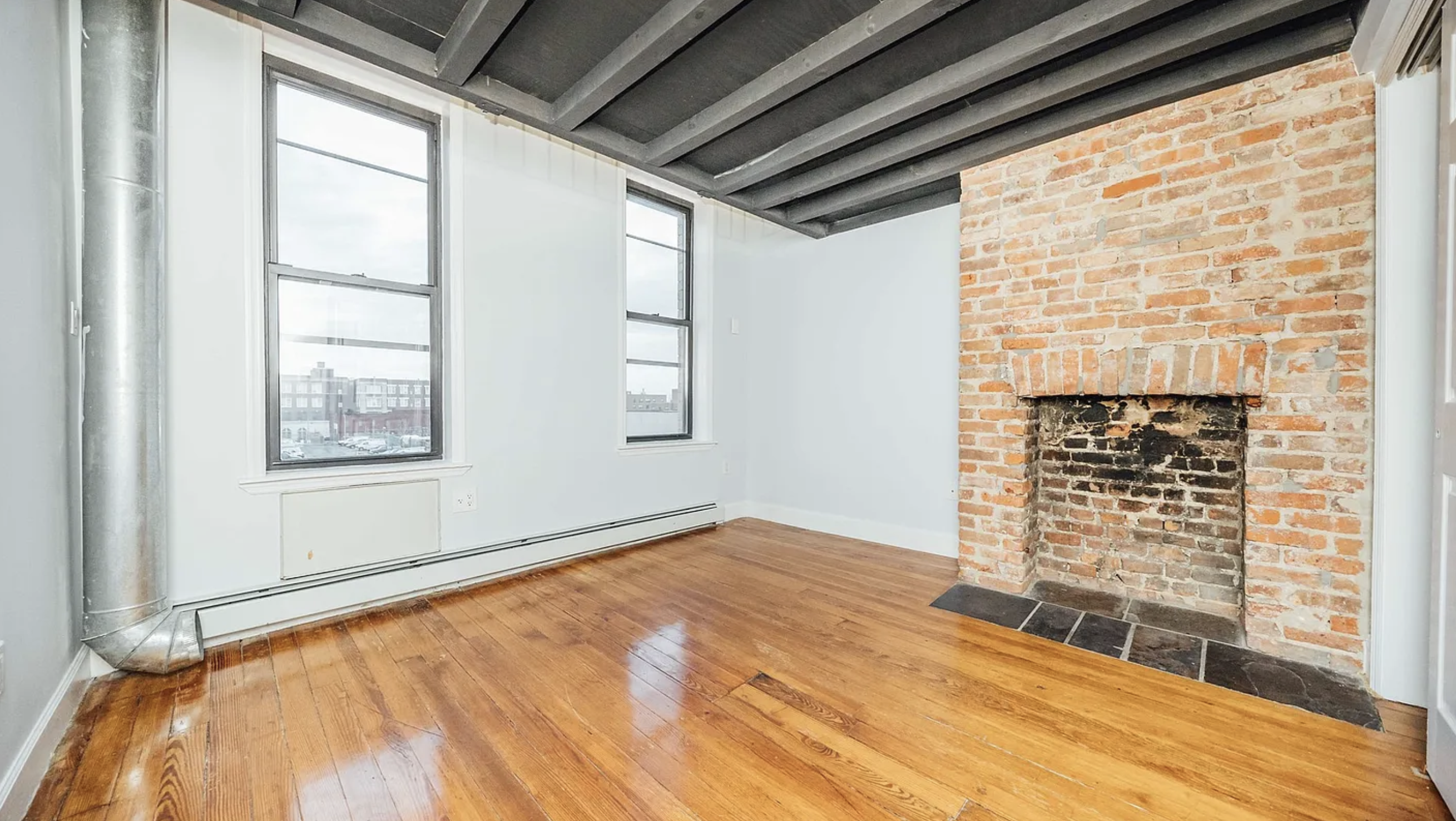 132 Jefferson Street, Unit 3L Brooklyn, NY 11206 - Photo 7 of 12 a view of an empty room with a window