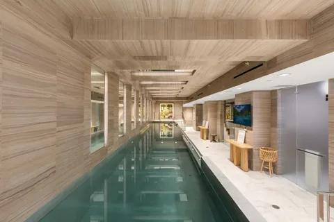 a view of a living room and balcony