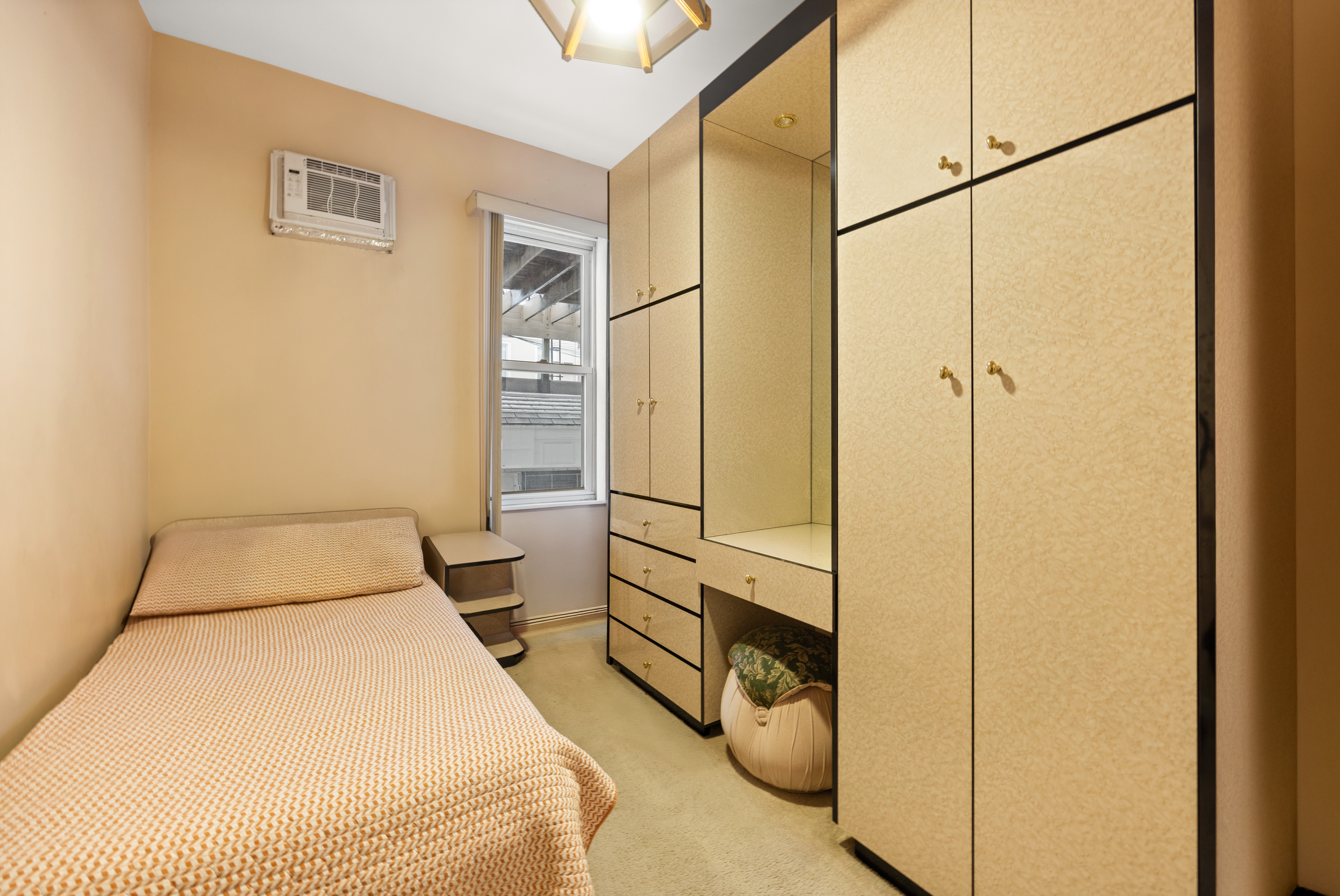 1635 West 12th Street Brooklyn, NY 11223 - Photo 14 of 21 a bedroom with a bed and a window