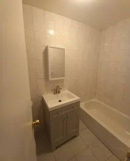 a kitchen with stainless steel appliances granite countertop a refrigerator a stove a sink and a microwave