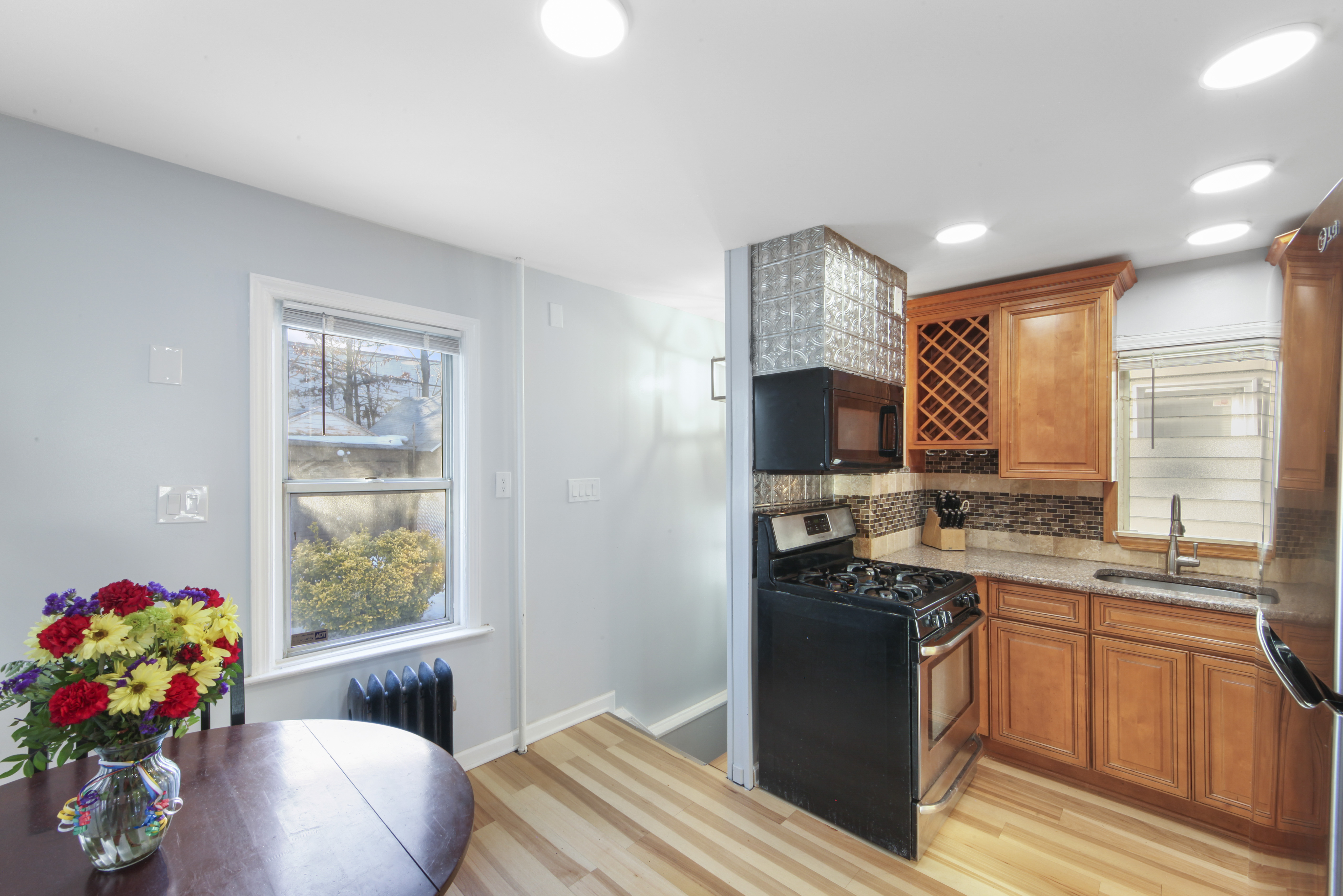 1530 East 51st Street Brooklyn, NY 11234 - Photo 4 of 14 a kitchen with stainless steel appliances granite countertop a sink stove and refrigerator