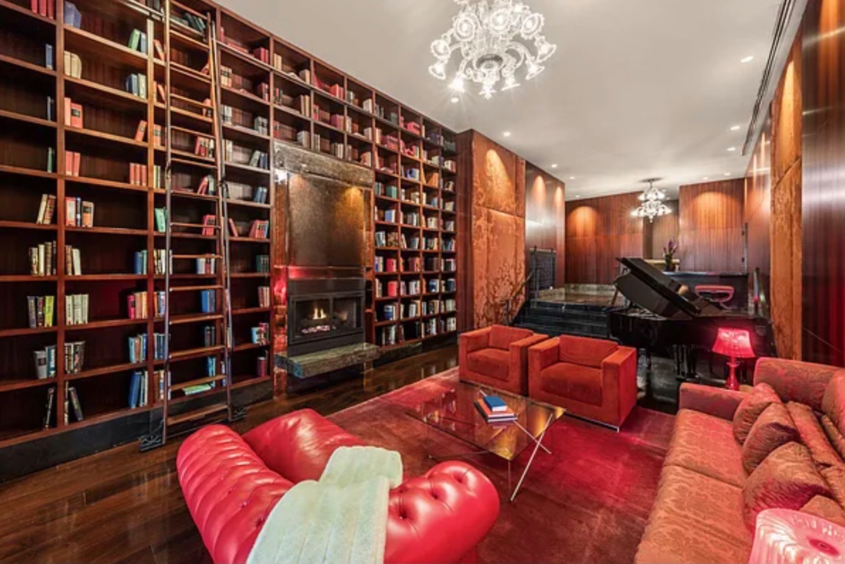 88 Greenwich Street, Unit 1014 Manhattan, NY 10006 - Photo 10 of 14 a living room with furniture and a bookshelf