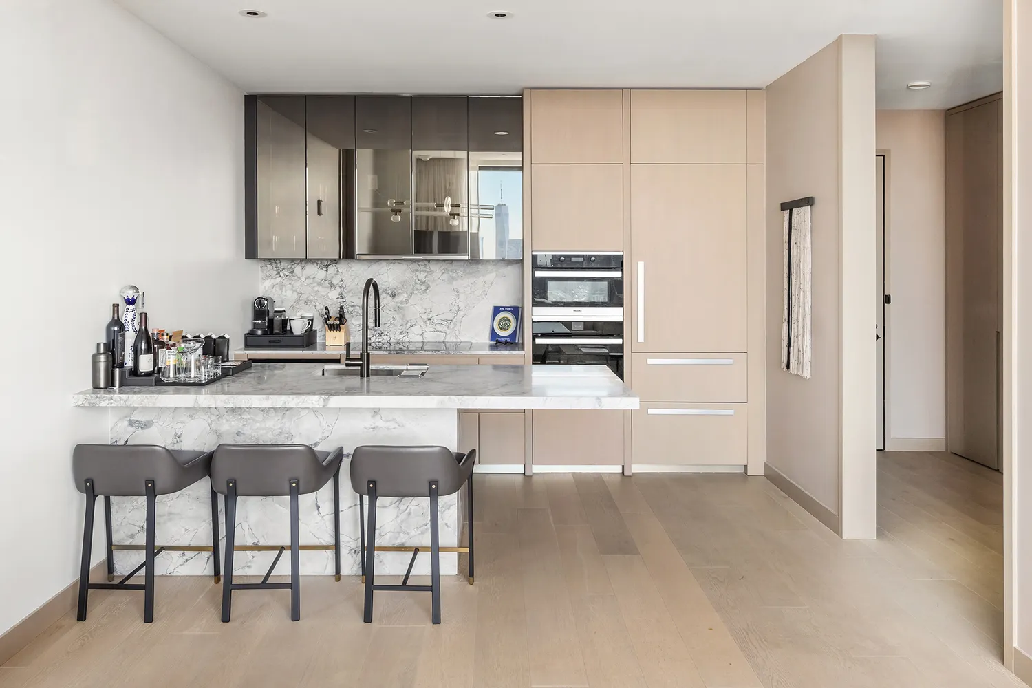 a kitchen with appliances a sink and cabinets