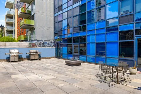 a view of a chairs and a table in the patio
