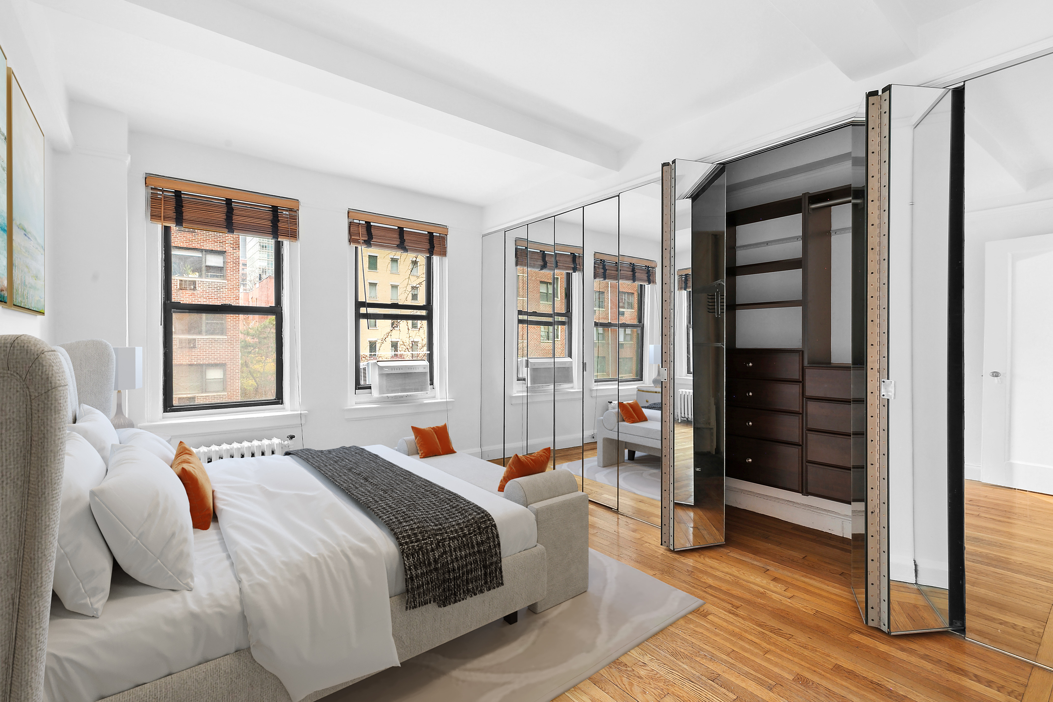 321 East 54th Street, Unit 4A Manhattan, NY 10022 - Photo 3 of 9 a spacious bedroom with a bed and wooden floor