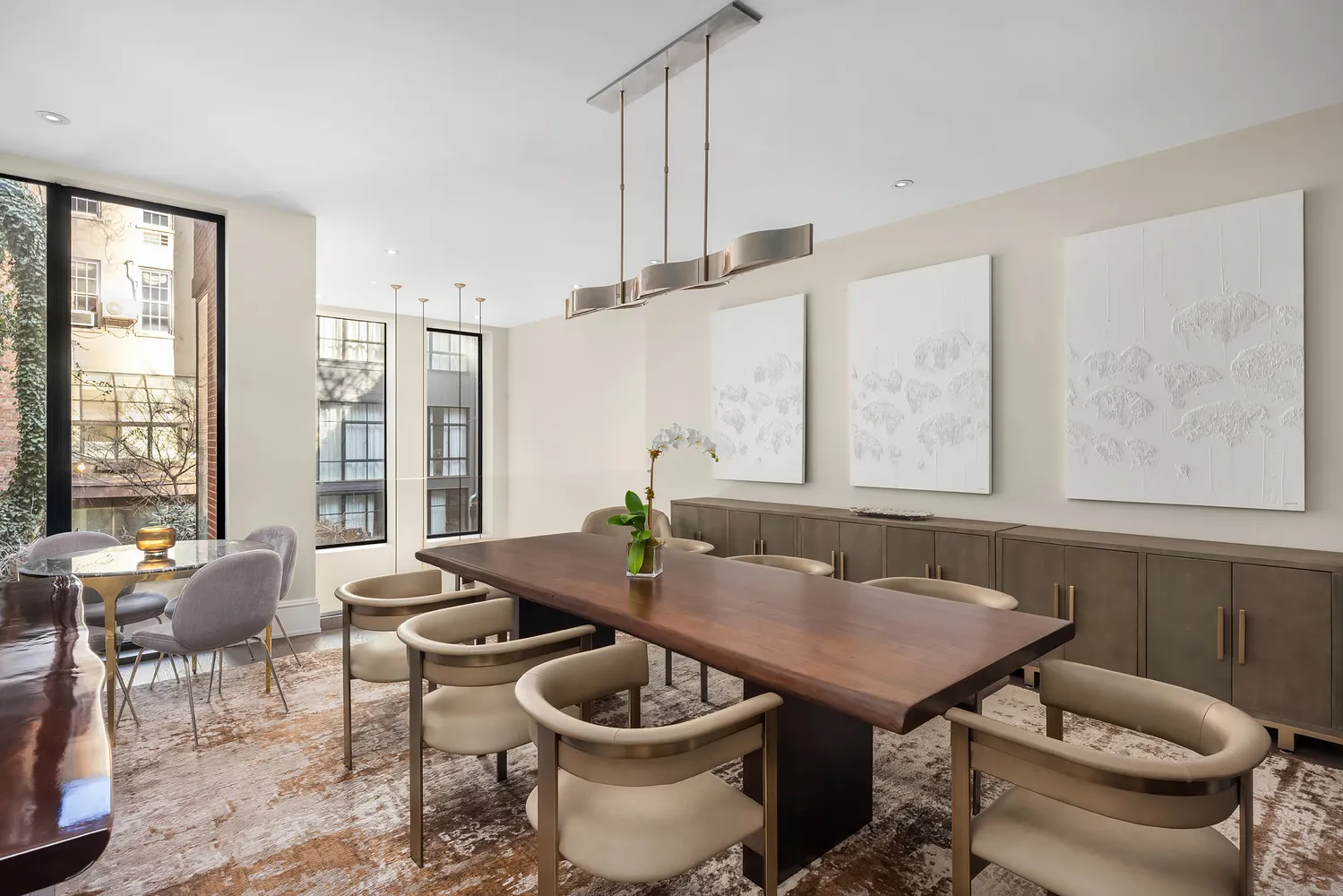 a view of a dining room with furniture window and outside view
