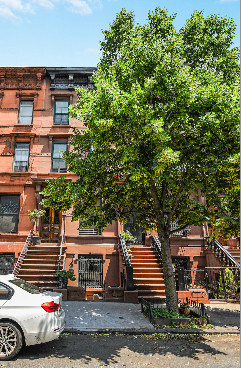 347 West 121st Street Manhattan, NY 10027 - Photo 15 of 16 a front view of a building with garden