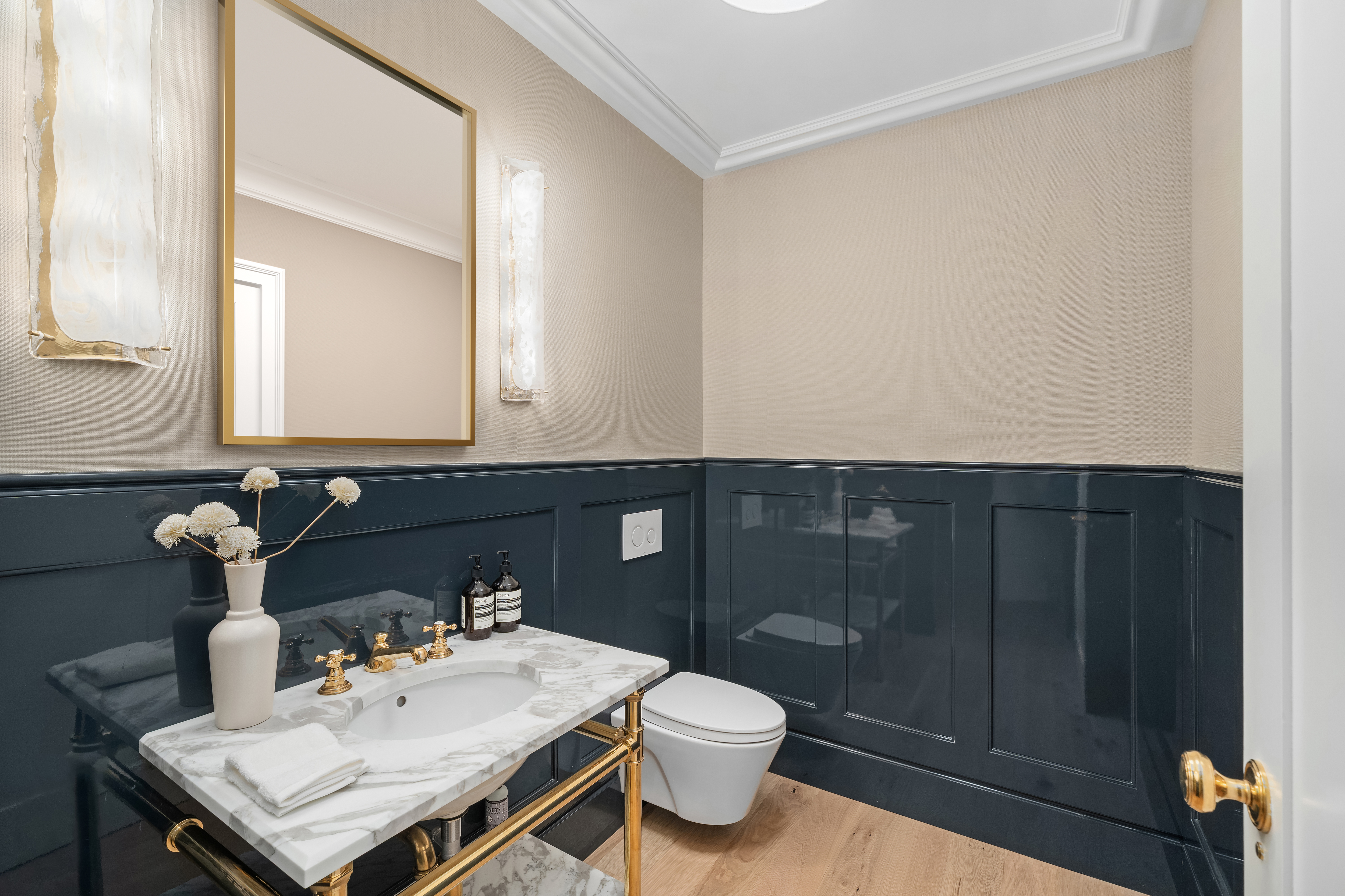 1020 5th Avenue, Unit 9 Manhattan, NY 10028 - Photo 25 of 27 a bathroom with a sink vanity and toilet