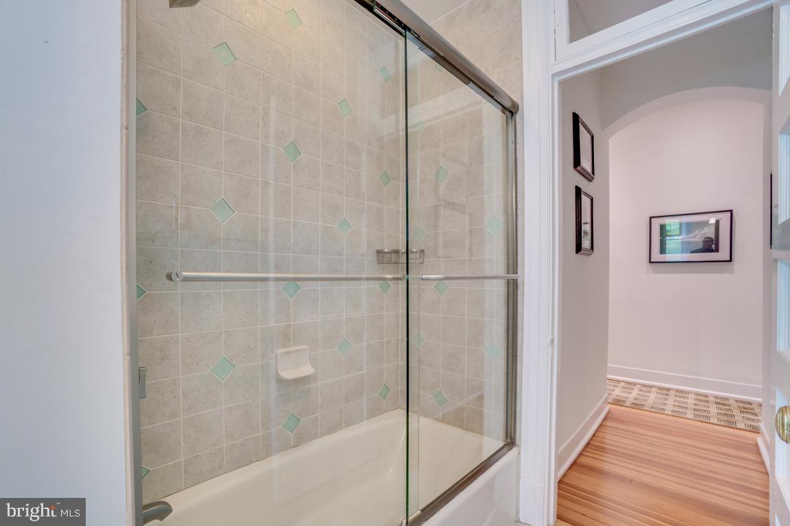 2415 20th Street Northwest, Unit 38 Washington, DC 20009 - Photo 20 of 30 a bathroom with a bathtub and a shower