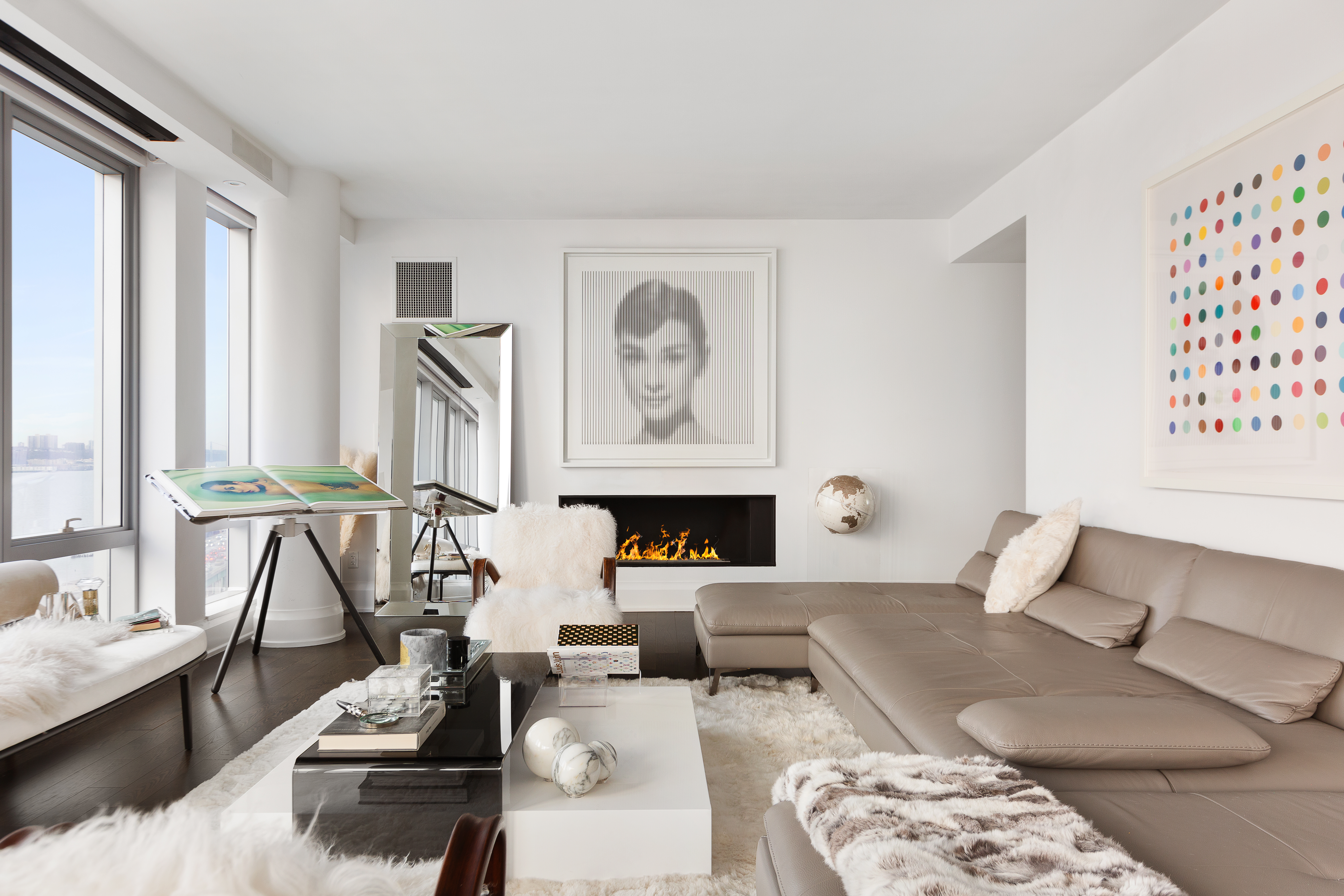 50 Riverside Boulevard, Unit 14L Manhattan, NY 10069 - Photo 3 of 21 a living room with furniture and fireplace