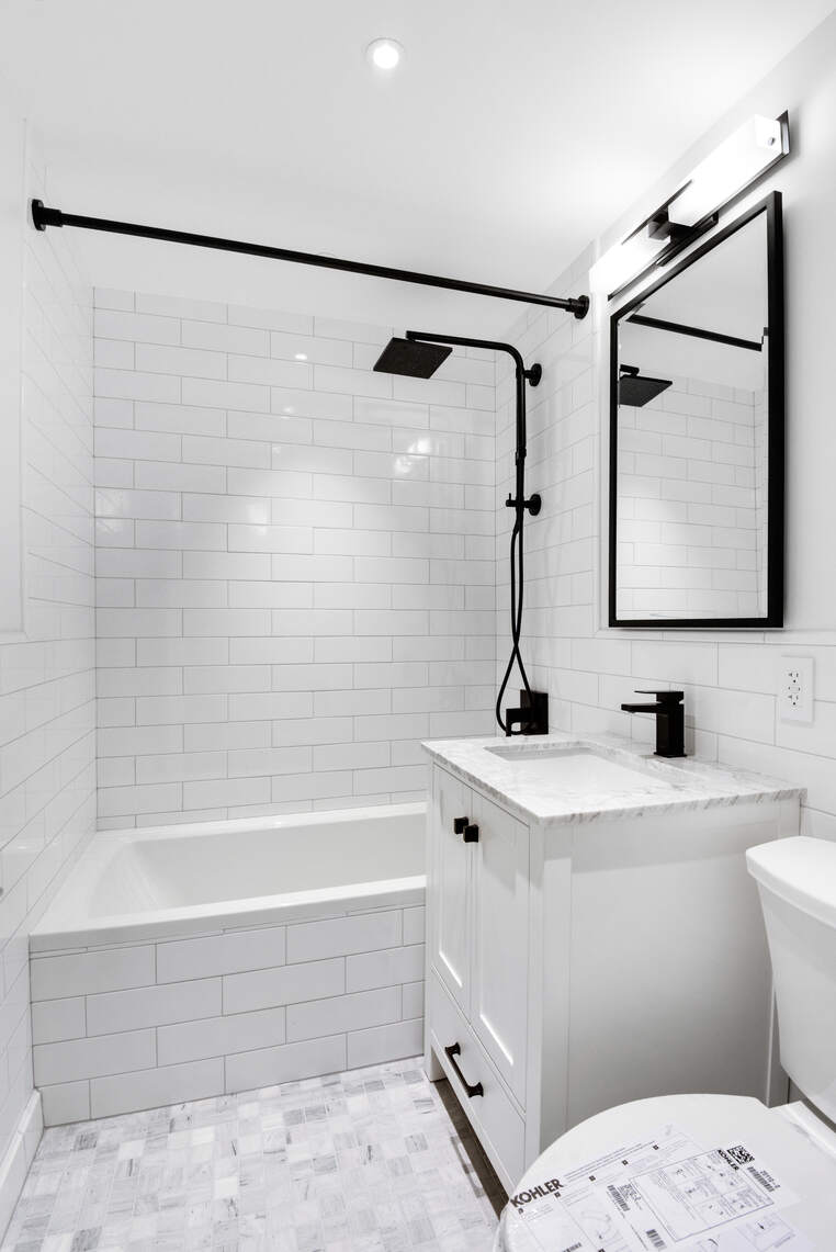 170 West End Avenue, Unit 12B Manhattan, NY 10023 - Photo 10 of 15 a bathroom with a sink and a mirror