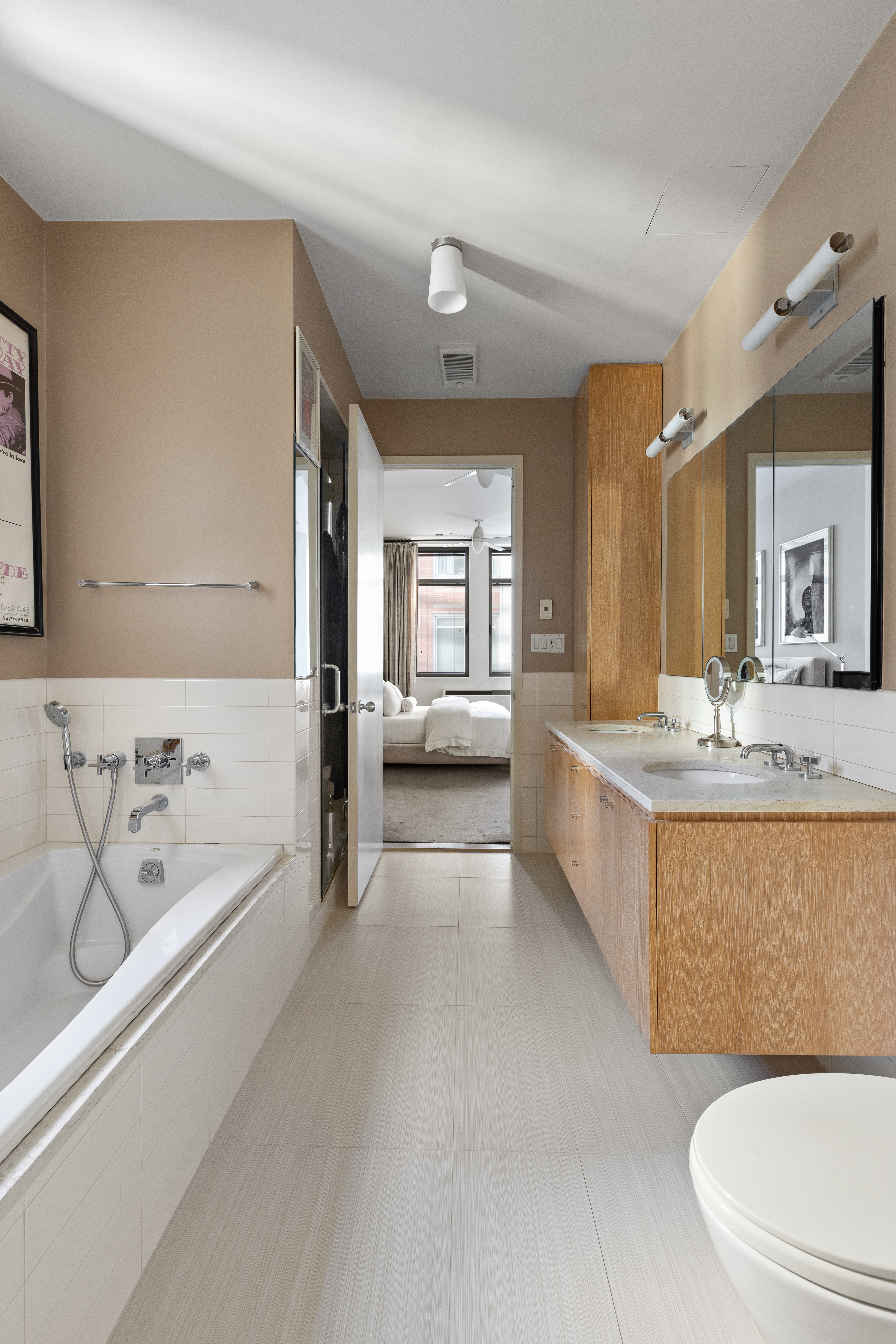 252 7th Avenue, Unit 9X Manhattan, NY 10001 - Photo 12 of 26 a bathroom with a bathtub shower sink and toilet