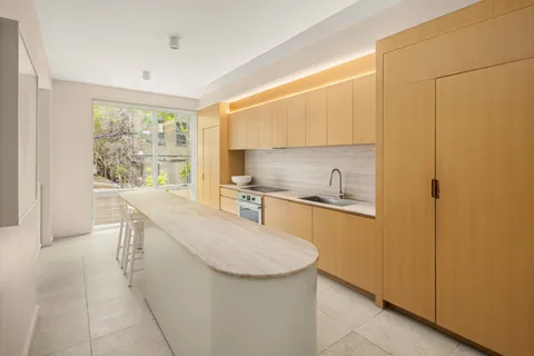 a kitchen with stainless steel appliances granite countertop a sink and a stove