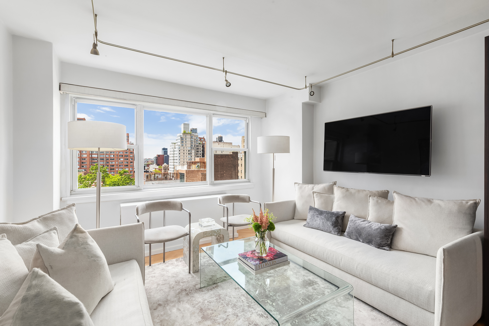 a living room with furniture and a flat screen tv