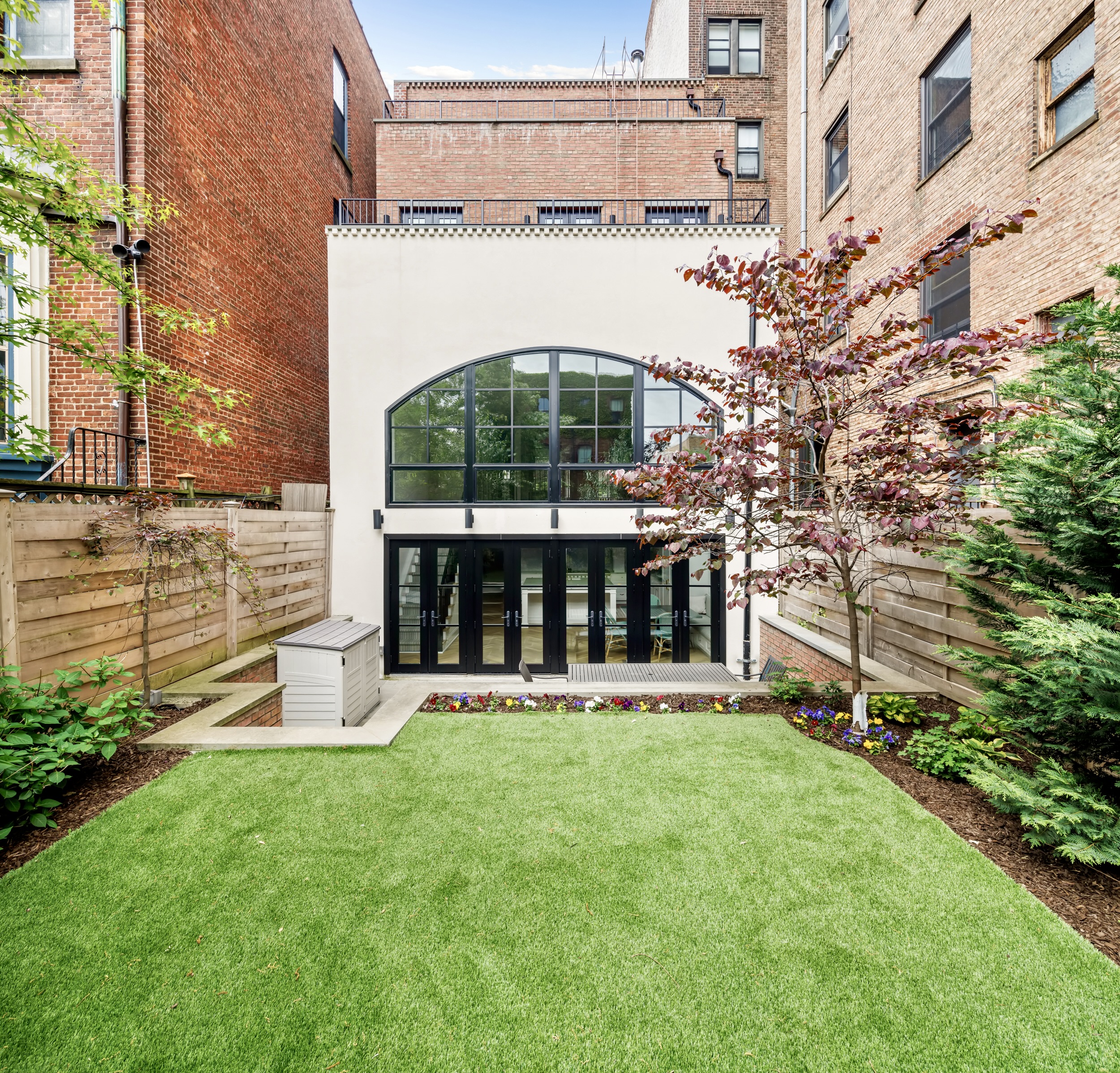 435 Clinton Avenue Brooklyn, NY 11238 - Photo 11 of 27 front view of a building with a garden