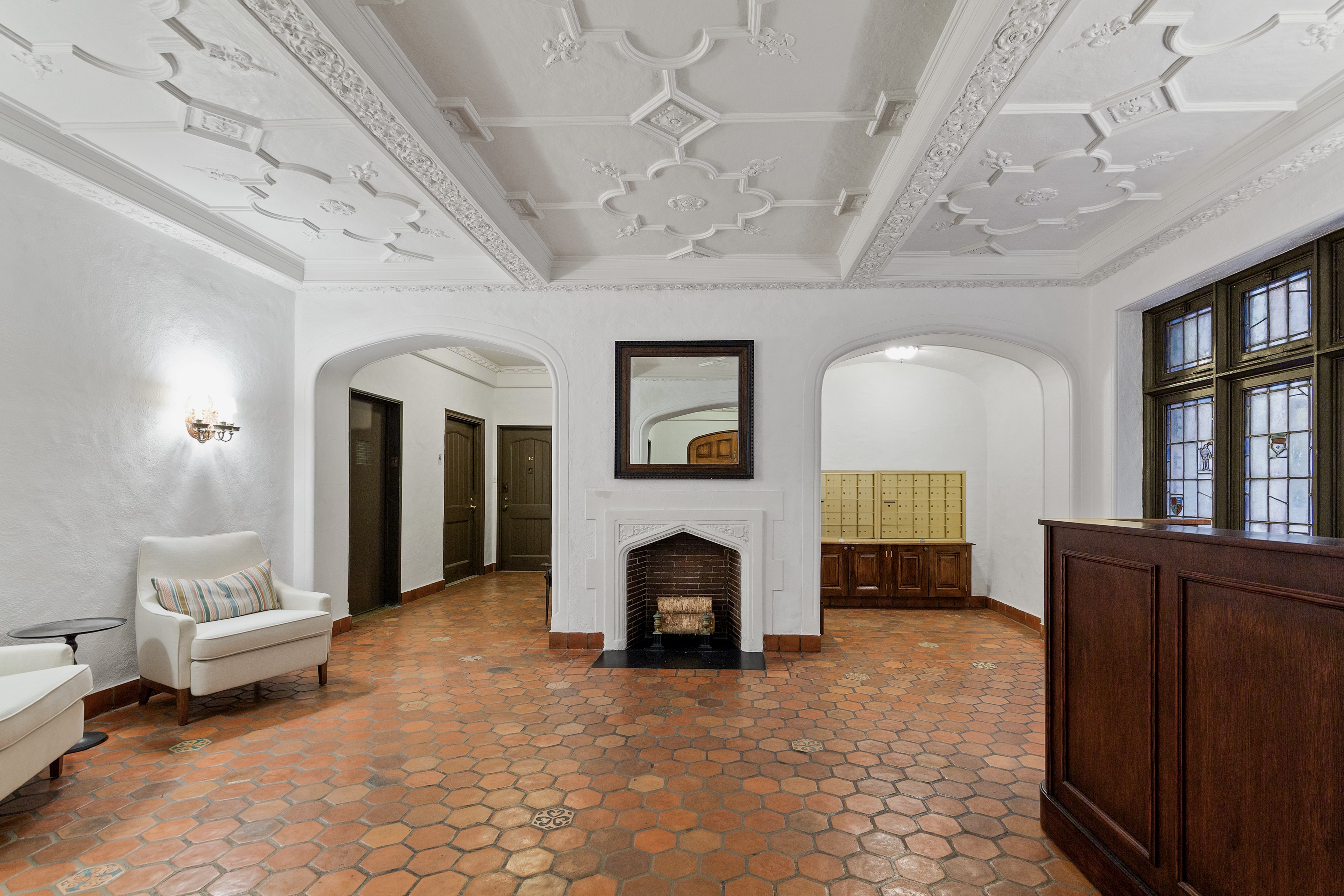 40 West 67th Street, Unit 1A Manhattan, NY 10023 - Photo 13 of 17 a living room with furniture and a fireplace