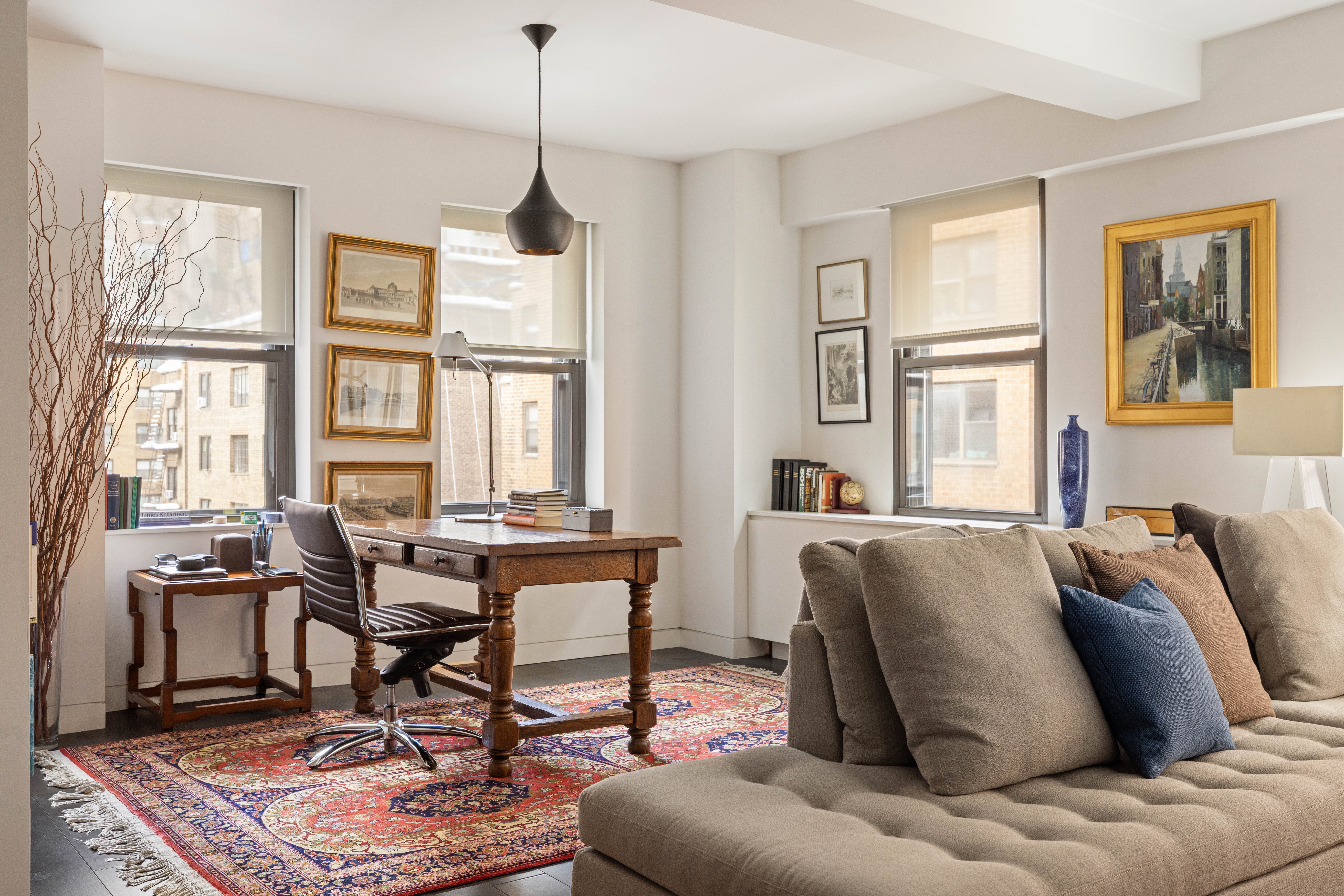2 Tudor City Place, Unit 8DS Manhattan, NY 10017 - Photo 5 of 14 a living room with furniture a table and large windows