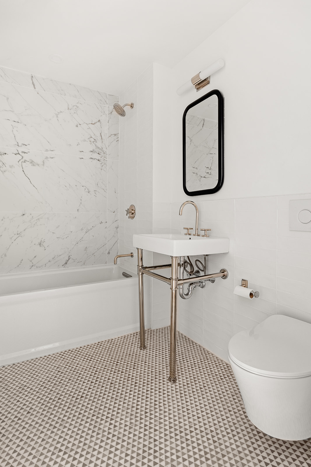 84 6th Avenue, Unit 1 Brooklyn, NY 11217 - Photo 8 of 14 a bathroom with a sink a mirror and a bathtub