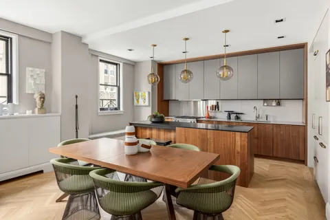 a room with a table and chairs