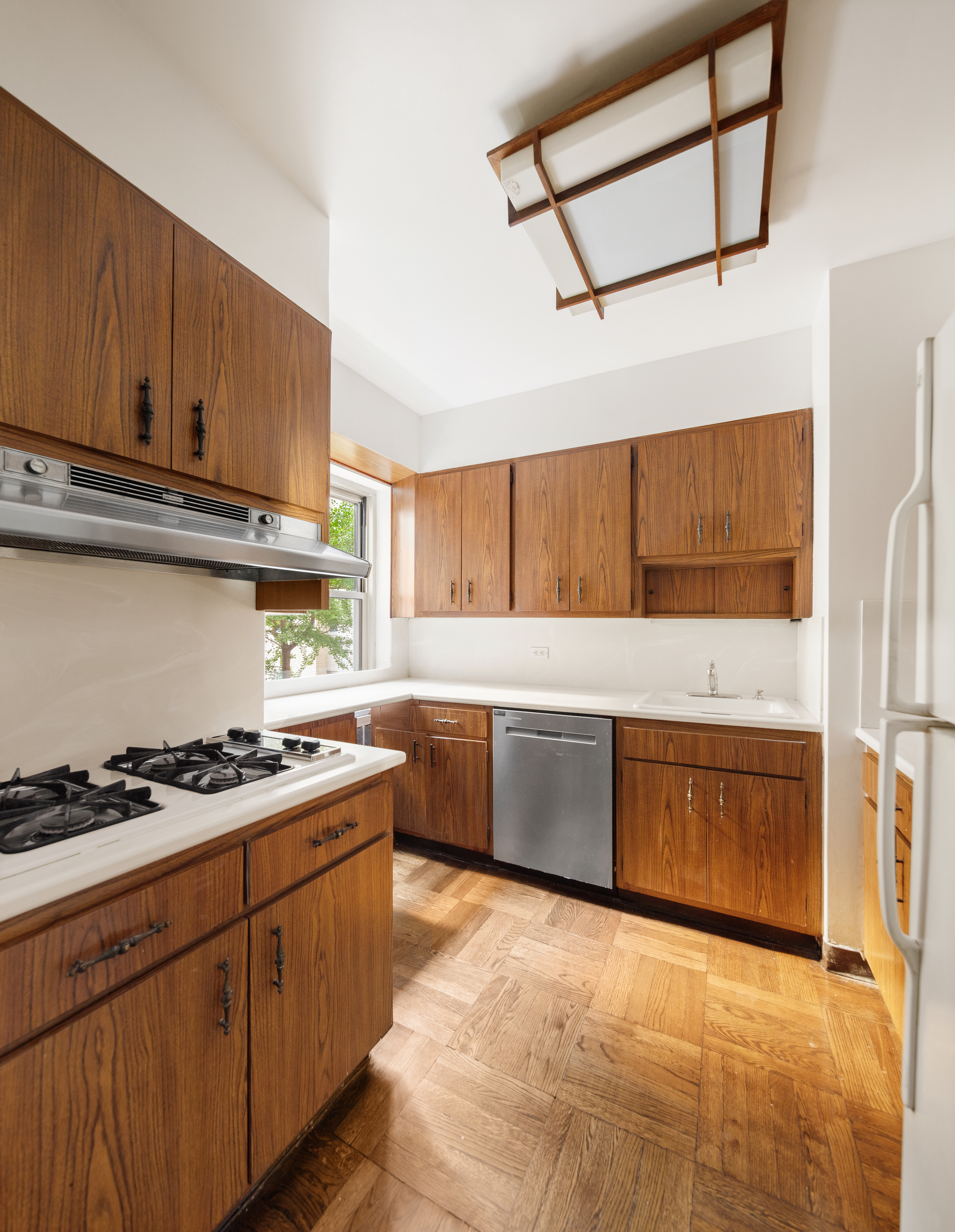11 5th Avenue, Unit 5LW Manhattan, NY 10003 - Photo 5 of 19 a kitchen with stainless steel appliances a stove a sink and cabinets