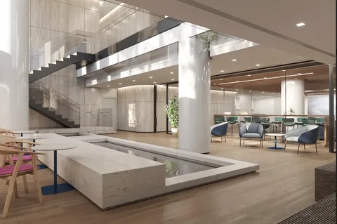 a living room with furniture a table and kitchen view