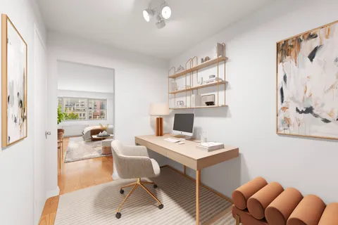 a workspace with furniture and window