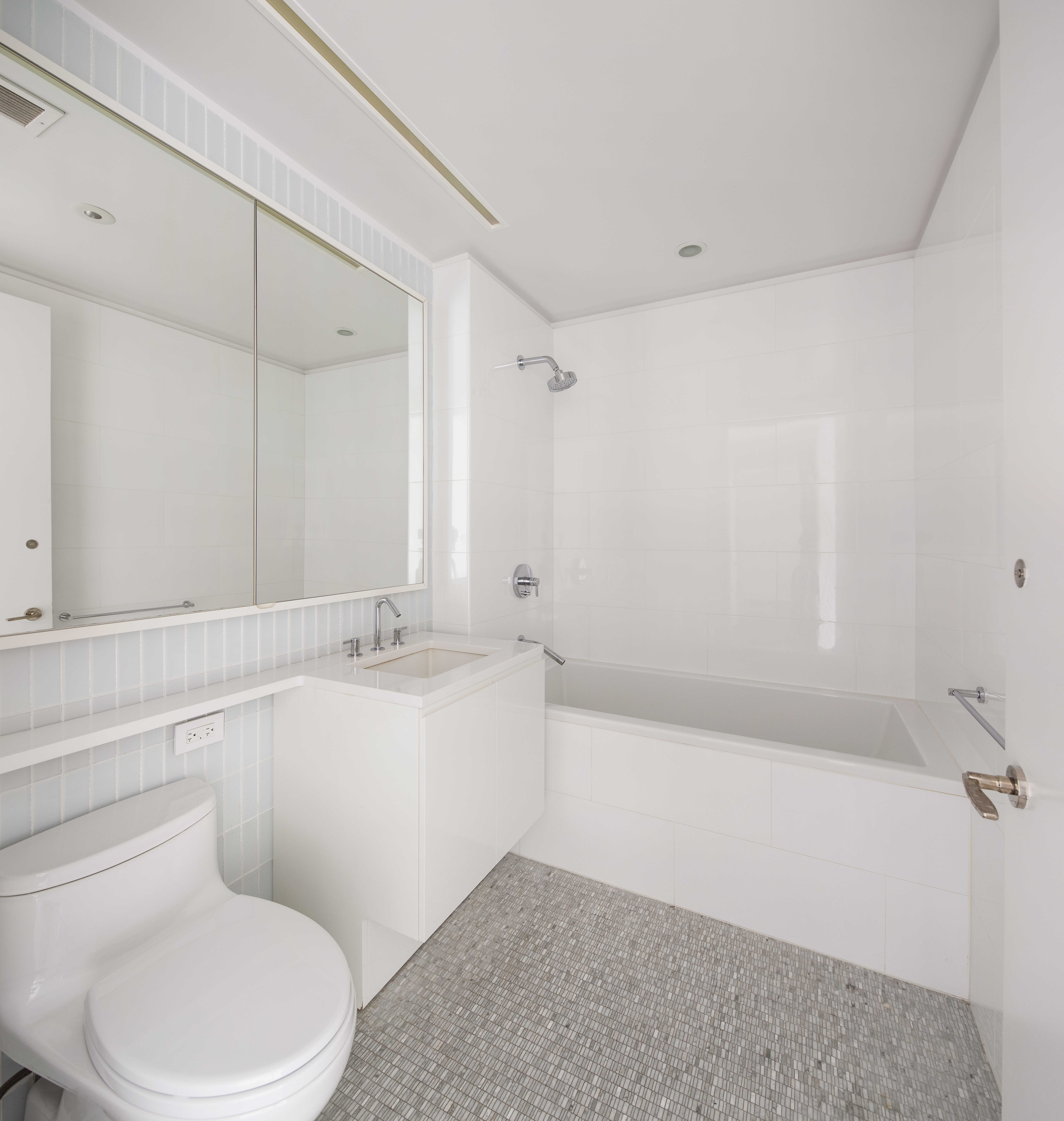 50 Riverside Boulevard, Unit 30B Manhattan, NY 10069 - Photo 13 of 14 a bathroom with a sink a toilet and bathtub