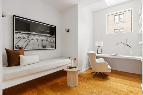 a bathroom with a toilet and a bathtub