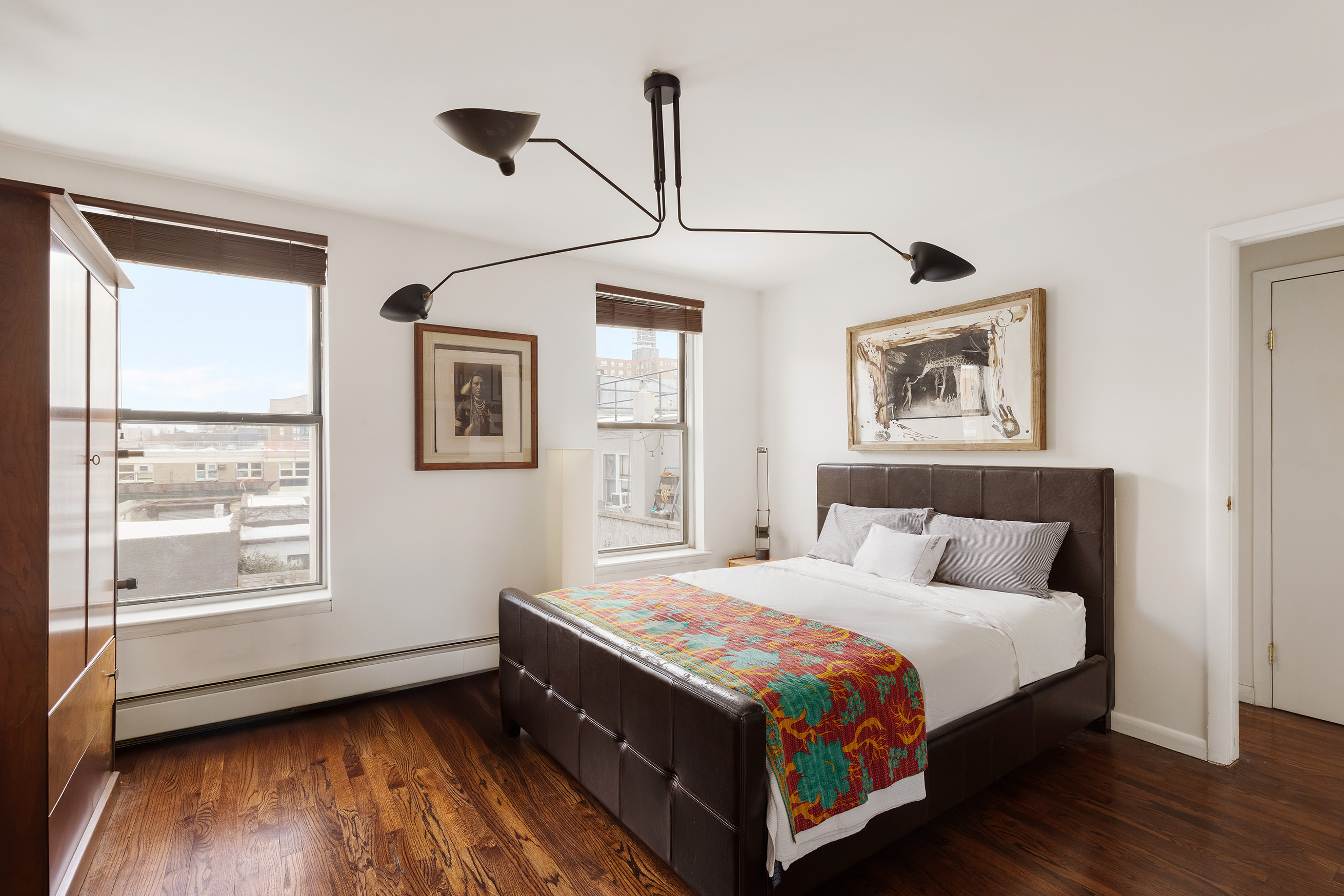 68 Dikeman Street Brooklyn, NY 11231 - Photo 6 of 17 a bedroom with a bed wooden floor and window
