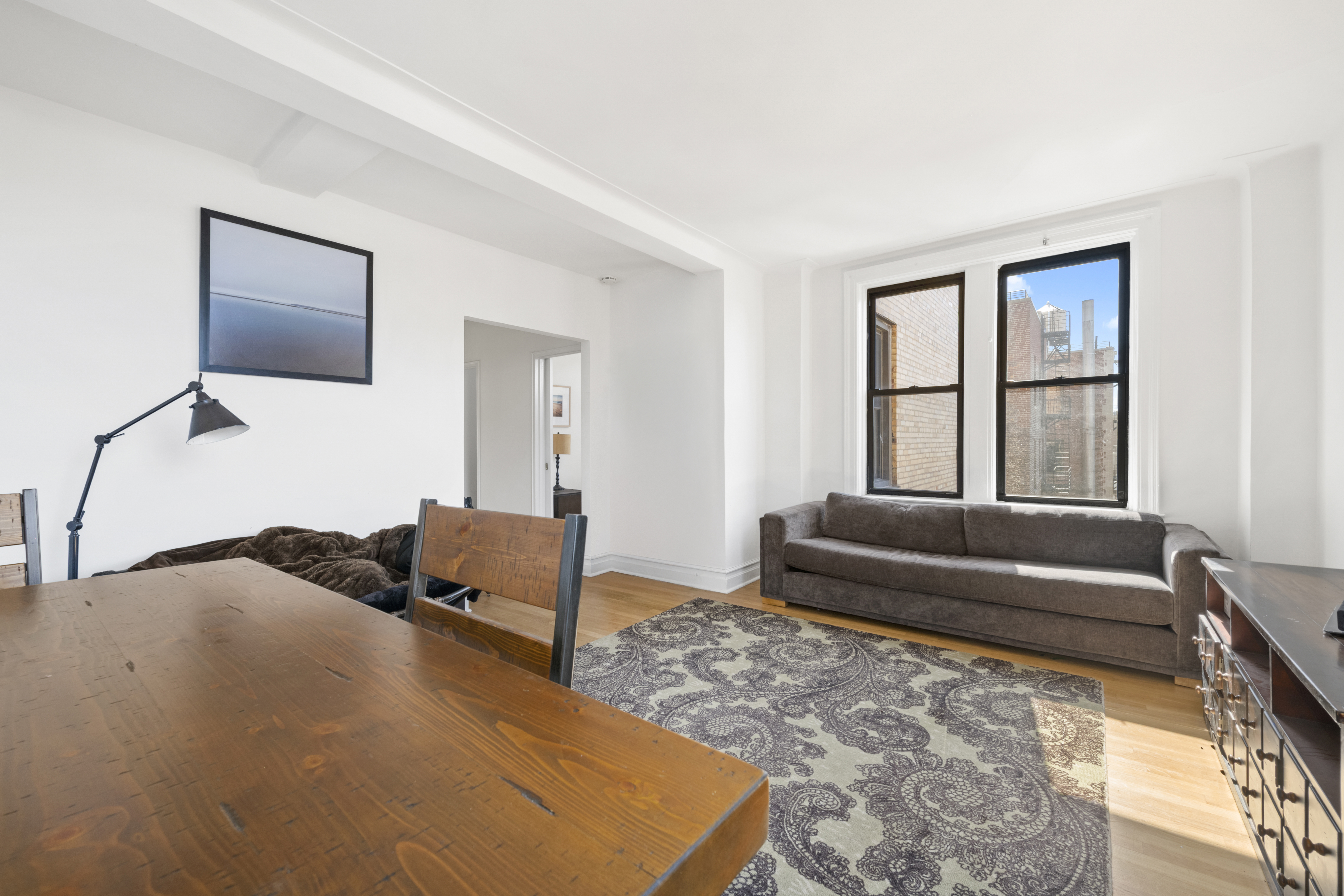 473 West End Avenue, Unit 13D Manhattan, NY 10024 - Photo 7 of 13 a living room with furniture and a couch