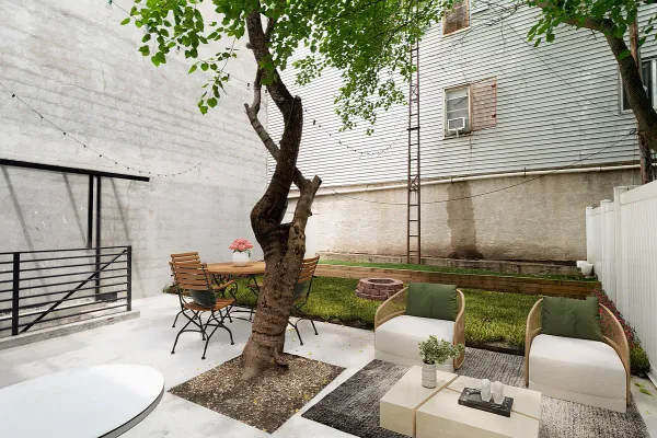 a balcony with table and chairs
