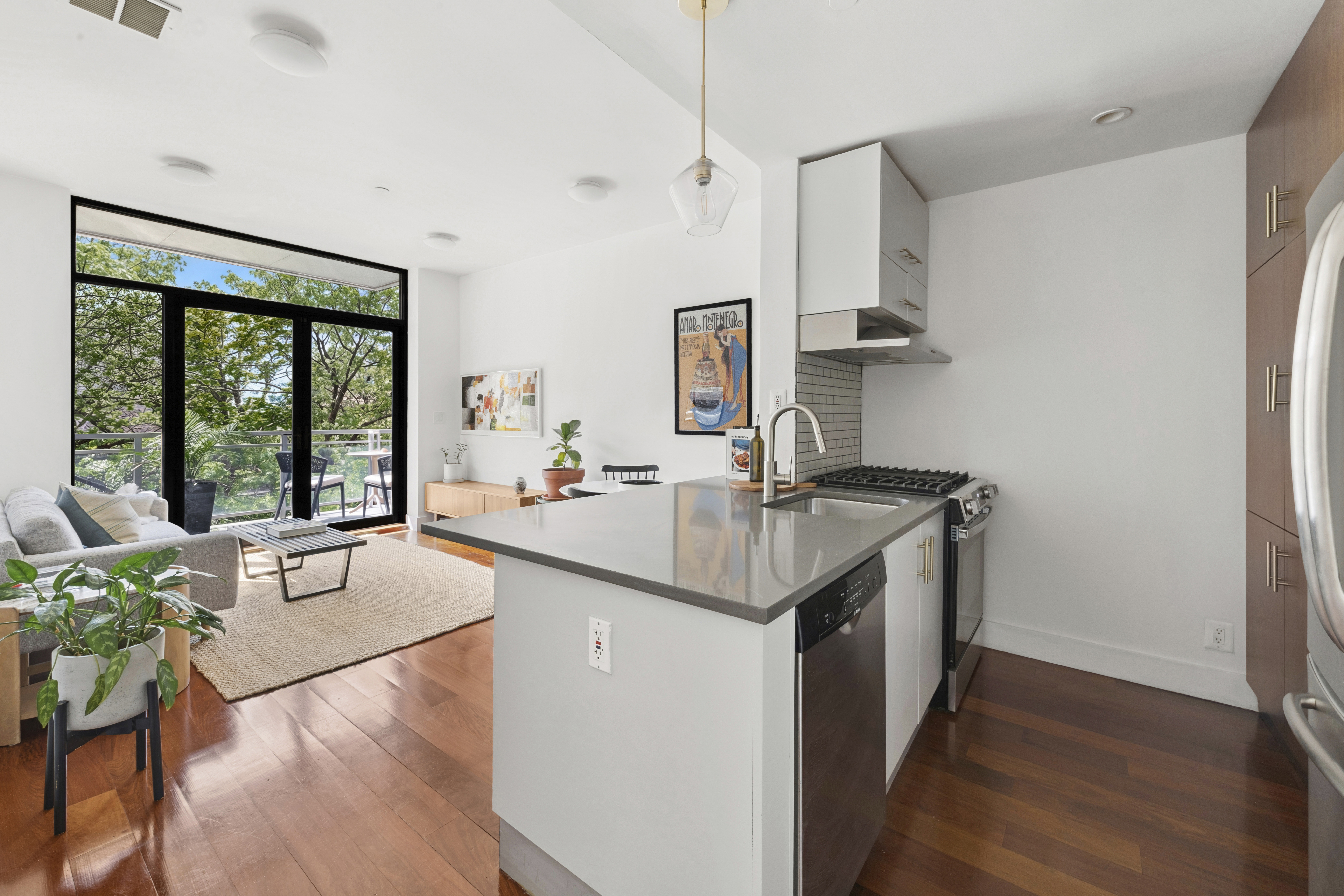 82 Adelphi Street, Unit 3D Brooklyn, NY 11205 - Photo 2 of 7 a kitchen with a sink cabinets and wooden floor