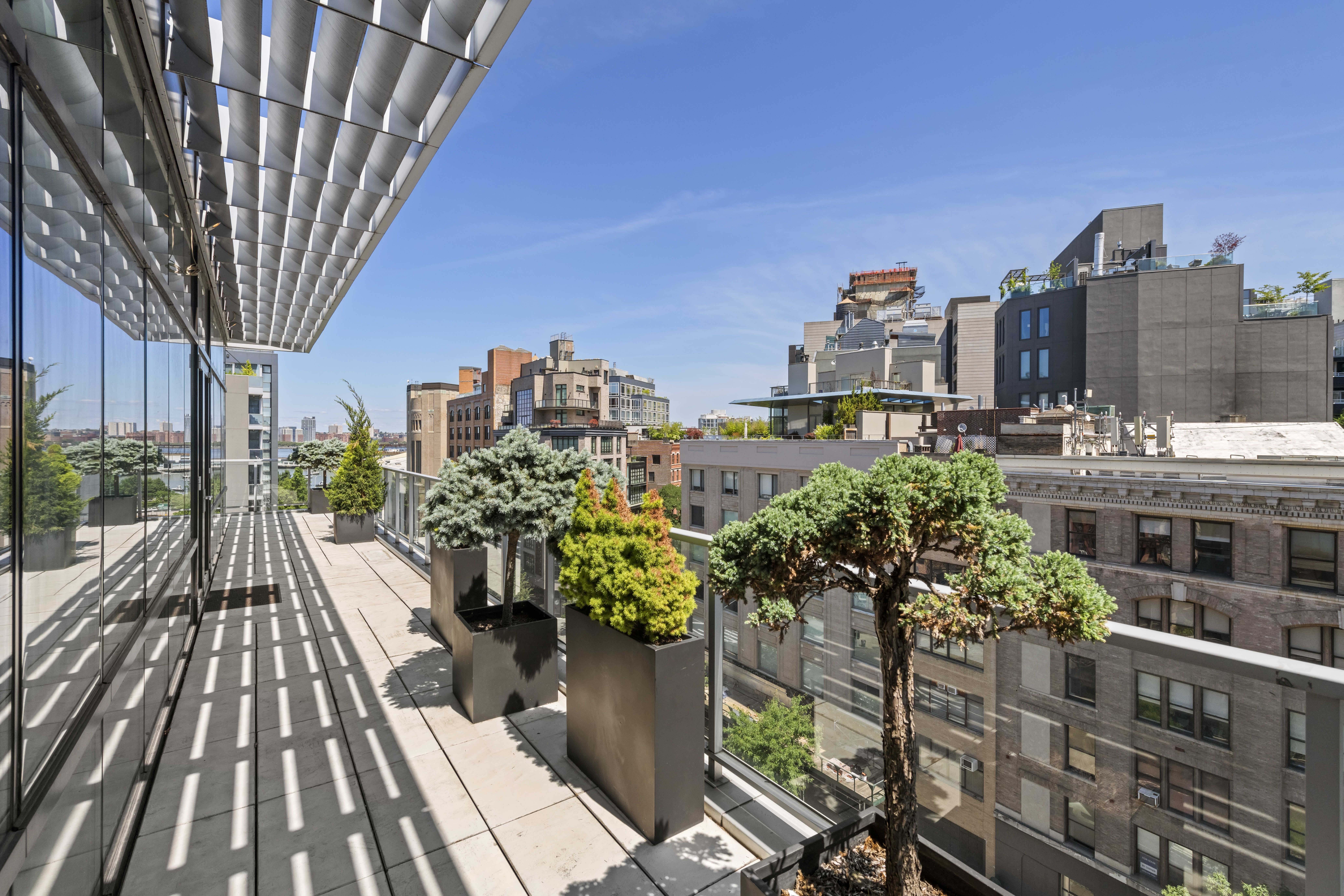 475 Greenwich Street, Unit PHN Manhattan, NY 10013 - Photo 8 of 28 a view of balcony with wooden floor and outdoor seating