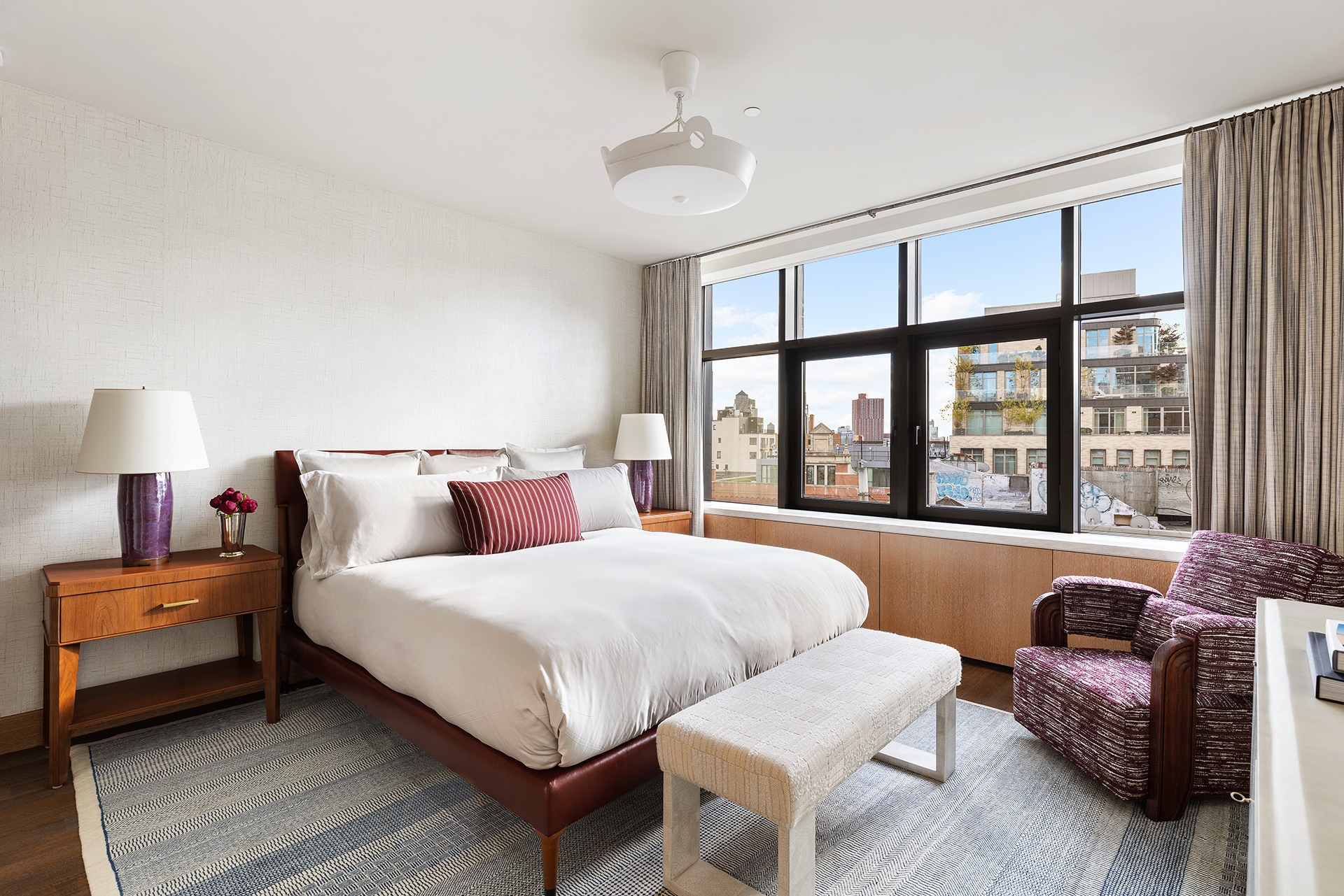 25 Bond Street, Unit PHW Manhattan, NY 10012 - Photo 23 of 34 a bedroom with a bed and a large window