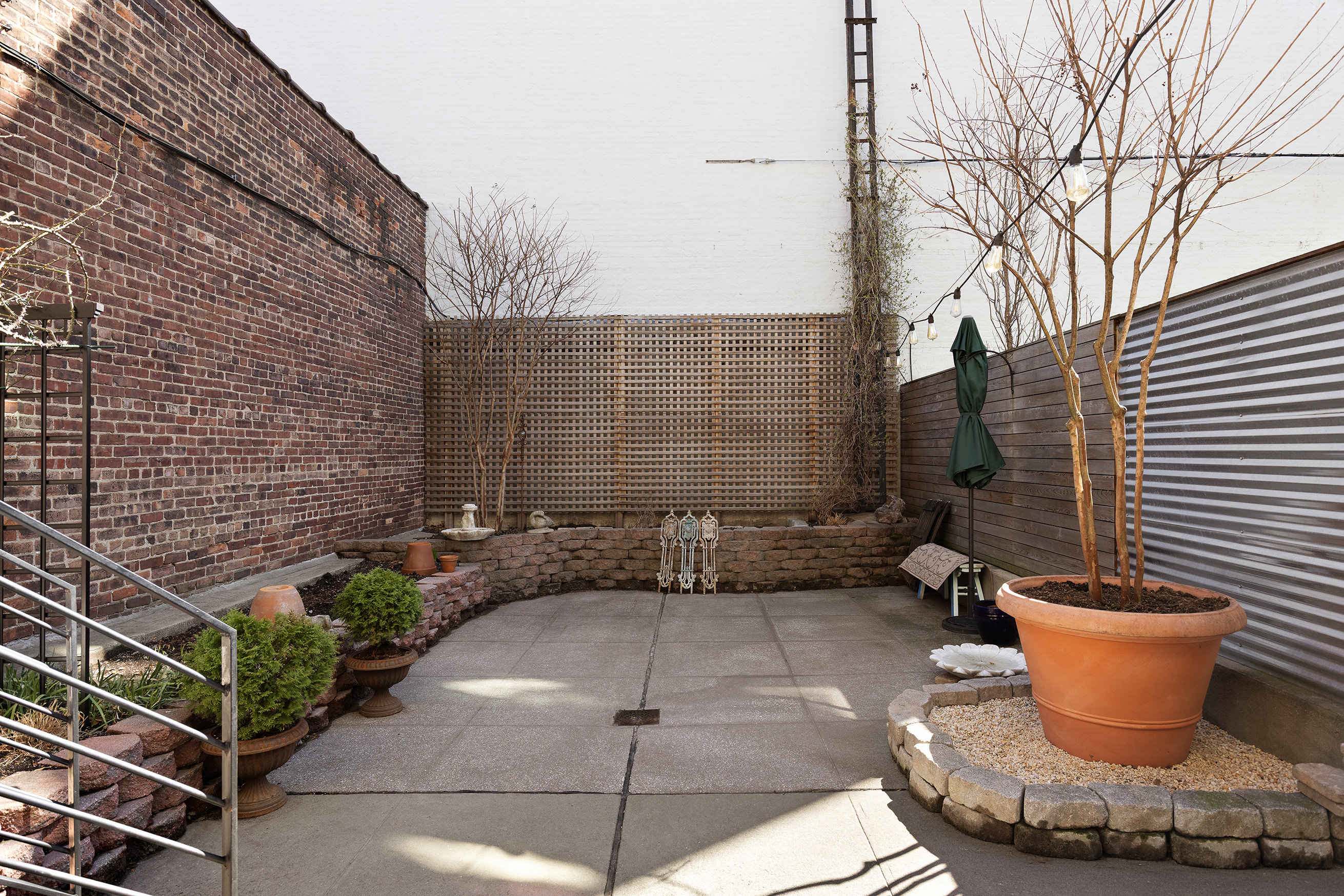 429 Clinton Street, Unit 1 Brooklyn, NY 11231 - Photo 16 of 21 a view of a patio with couches and potted plants
