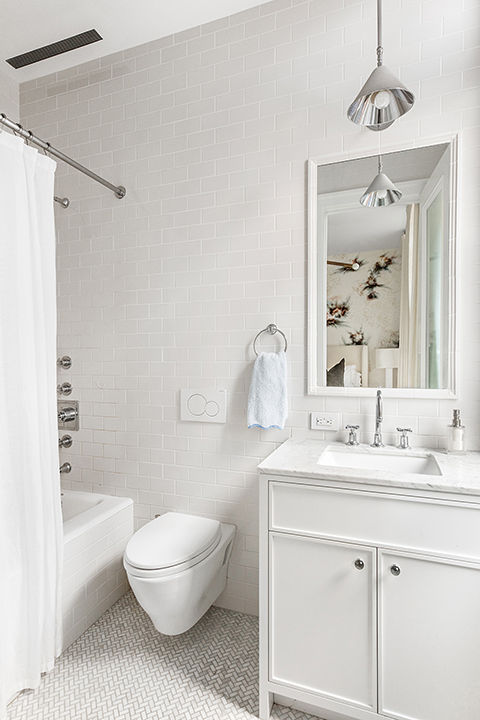 92 Laight Street, Unit 3ABC Manhattan, NY 10013 - Photo 19 of 26 a bathroom with a sink a toilet a mirror a bathtub and shower