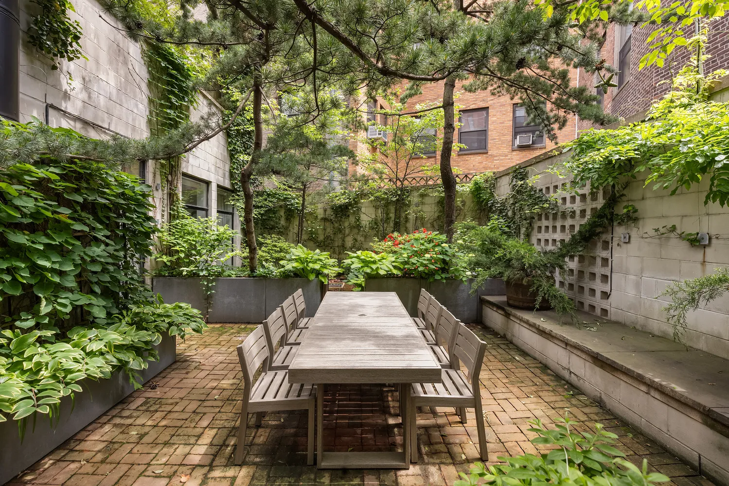 a wooden bench sitting in front of a building