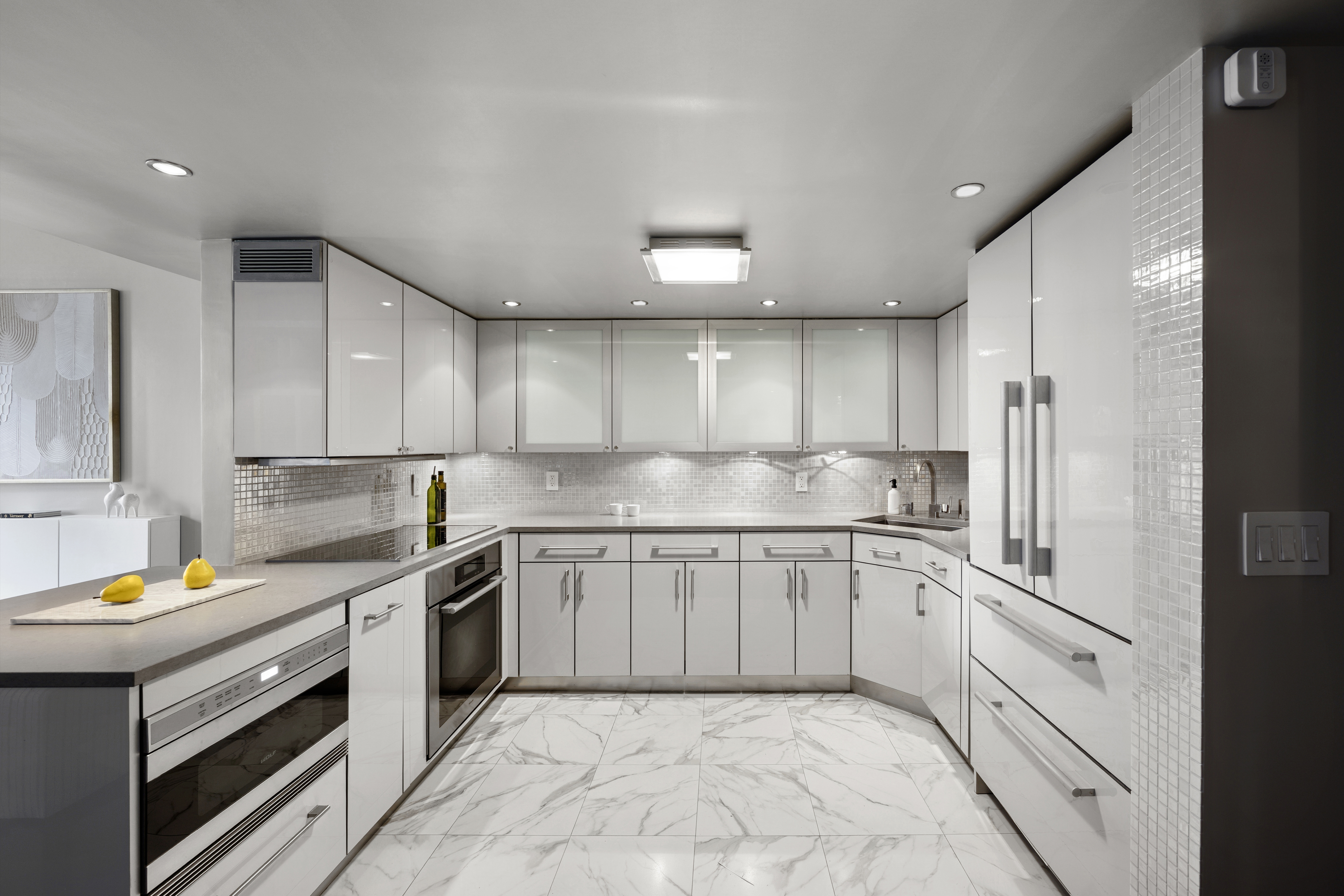 253 West 73rd Street, Unit 6B-C Manhattan, NY 10023 - Photo 9 of 21 a kitchen with a sink stove and cabinets