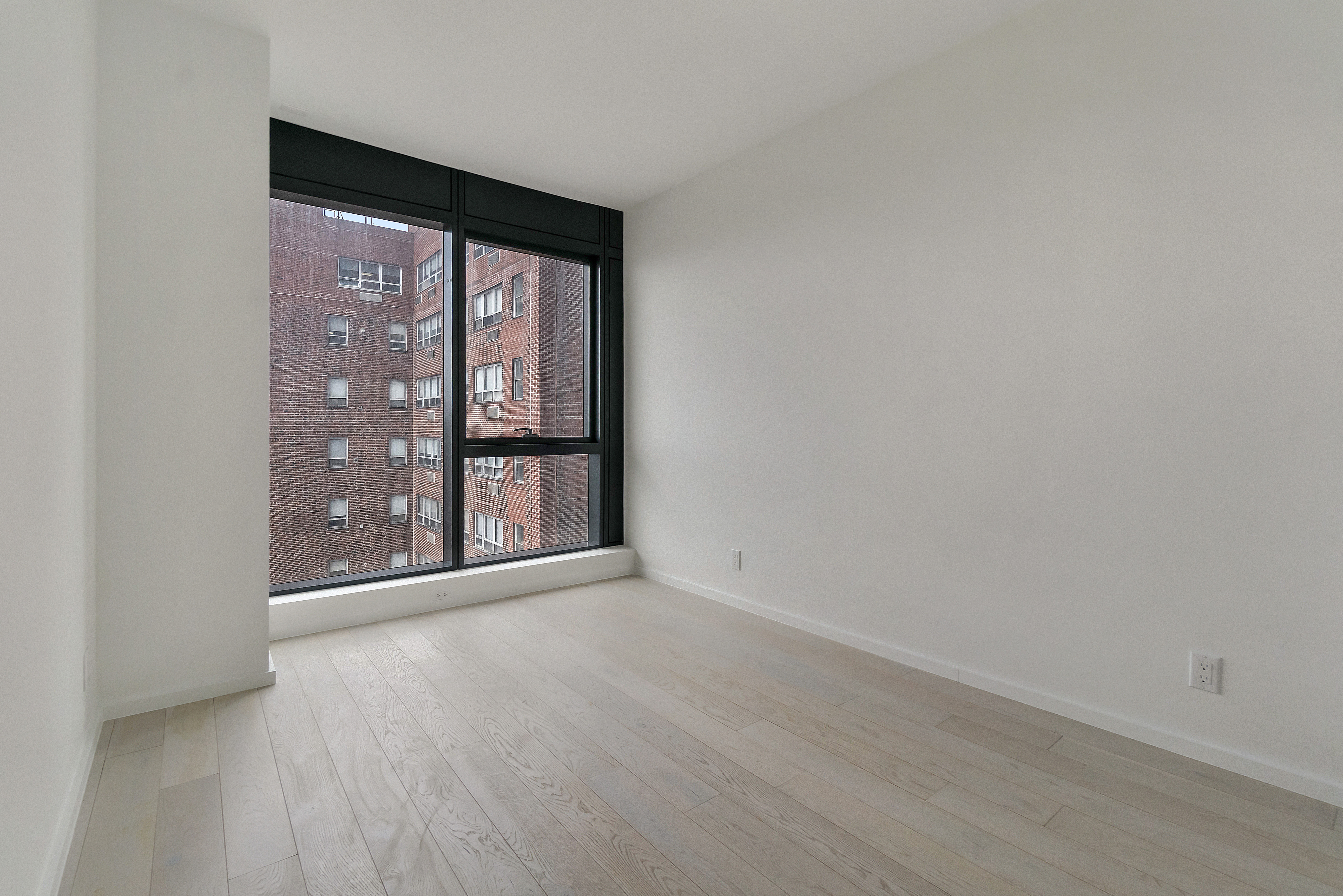 2286 Cropsey Avenue, Unit 6G Brooklyn, NY 11214 - Photo 7 of 22 wooden floor and window in an empty room