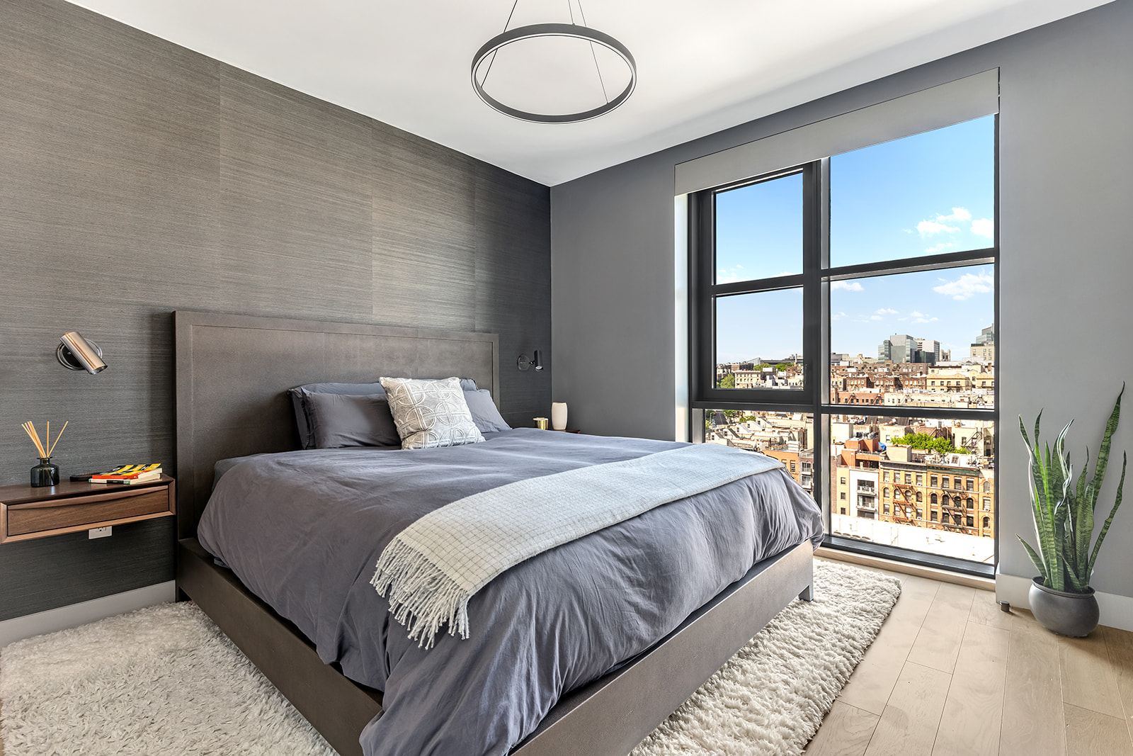 11 Hancock Place, Unit PH201 Manhattan, NY 10027 - Photo 3 of 10 a bedroom with a bed and a large window