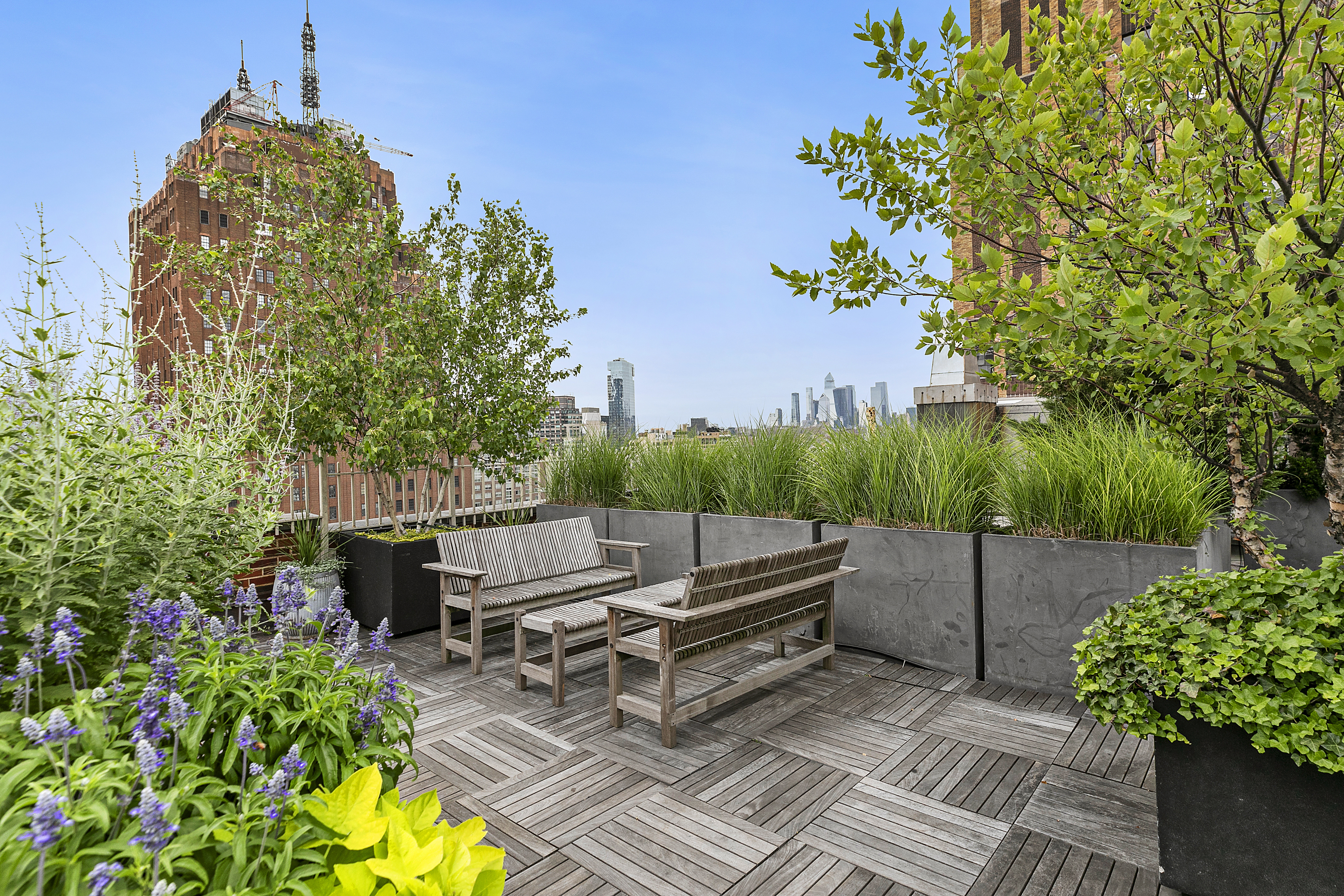 a backyard of a house with lots of green space and outdoor seating